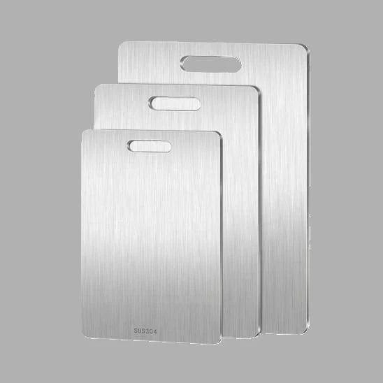 trois grandeurs de planche à découper inox