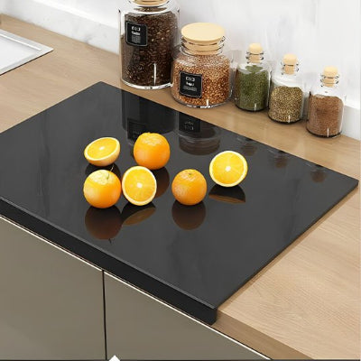 Planche à découper acrylique noir oranges coupées