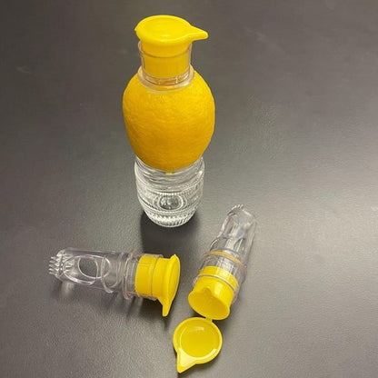 citron avec presse agrume et deux autres couchés auprès